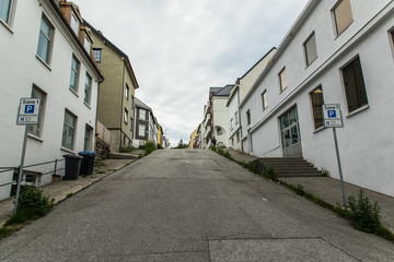 Fototapeta na wymiar ALESUND, Norway - June, 2019: Street of Norwegian town Alesund with Art Nouveau architecture.