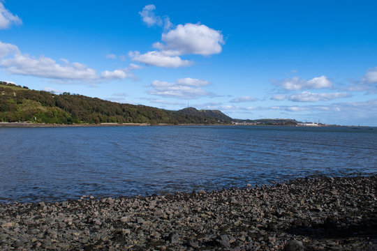 Waterfront at Silver Sands beach in Aberdour and Firth of Forth estuary, Fife. Aberdour is a scenic and historic village on the south coast of Fife, Scotland. Photograph taken in autumn, October.