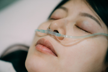 nasal cannula deliver oxygen for patient suffering respiratory disease. closed up view of sick...