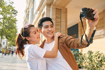 Happy tourists taking photo of themselves