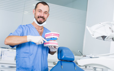 Orthodontist is telling about hygiene