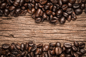 Coffee beans on wood background