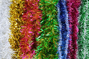 Christmas decoration multi-colored tinsel close-up.