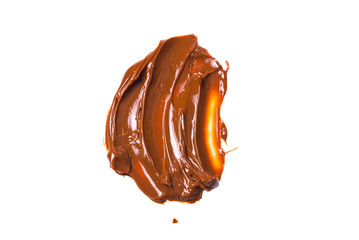 Melted tasty caramel splashes isolated on white background.