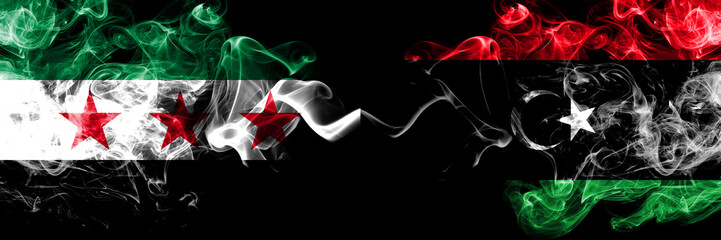 Syrian Arab Republic vs Libya, Libyan smoke flags placed side by side. Thick colored silky smoke flags of Syria opposition and Libya, Libyan