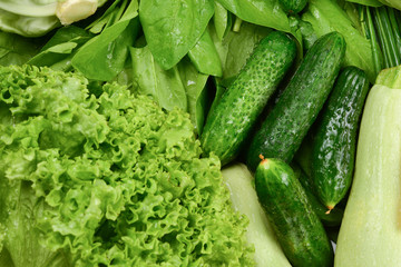 Fresh vegetables and herbs as a background.