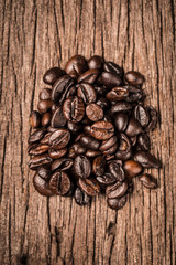 Coffee beans on wood background
