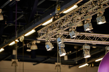 Lights in the ceiling of a dark exhibition hall
