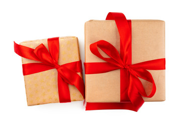 Craft christmas gifts with red bows isolated on white background, top view