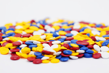 close up of colorful industrial plastic pellets background