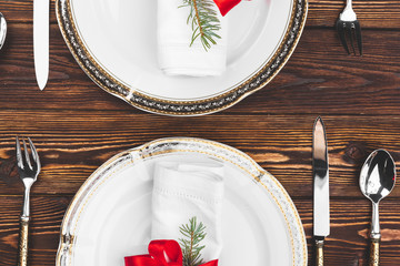 Brown wooden table with beautiful Christmas table setting