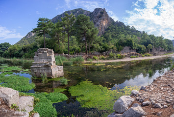 River through Olympos antique city ruins. Ancient bridge. Kemer, Antalya, Turkey.