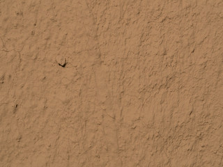 texture of a clay wall form a mud house