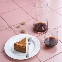 cheesecake and coffee on a pink background