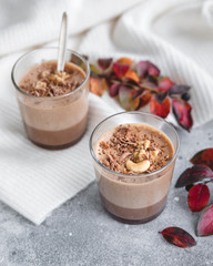 chocolate mousse with nuts in a glass cup