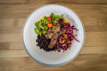 Succulent meat dish with salad, grilled vegetables and rice. Organic food. Top view