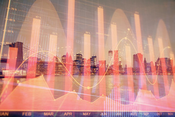 Financial graph on night city scape with tall buildings background multi exposure. Analysis concept.