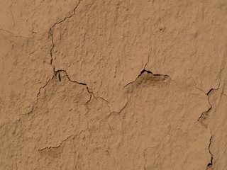 texture of a clay wall form a mud house