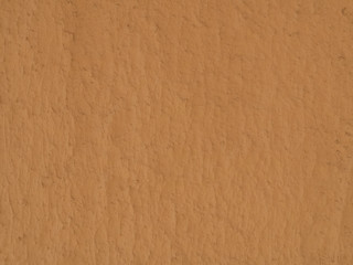 texture of a clay wall form a mud house