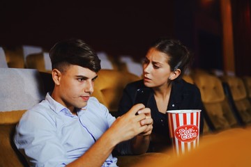 young couple watching movie