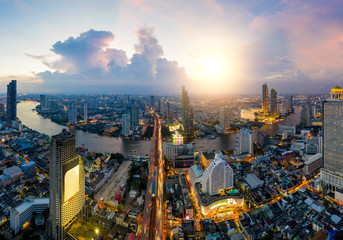 Aerial view of Bangkok modern office buildings,  in Bangkok city downtown with sunset scenery, Bangkok is the most populated city in Southeast Asia.Bangkok , Thailand