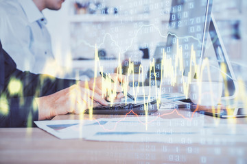 Forex graph with businessman working on computer in office on background. Concept of hardworking. Closeup. Multi exposure.