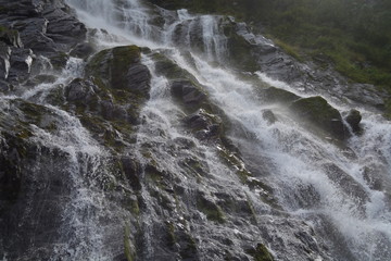 dynamic water flowing over rocks