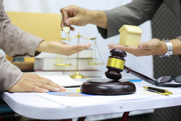 The lawyers are witnesses of giving the house to the customers who ordered the project.