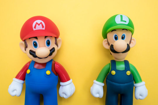 LONDON - JULY 31, 2019: Super Mario Luigi Nintendo video game character on yellow background