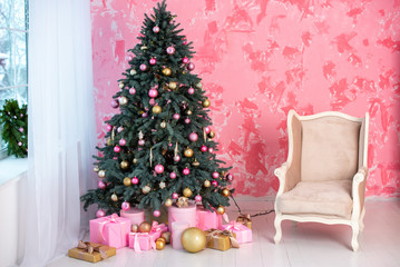 Beautiful holiday decorated room with Christmas tree and with presents. Cozy winter scene.