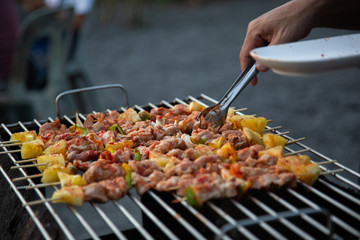 Barbeque Grill Street Food in thailand,Eat outdoors in a happy family. holiday celebration concept