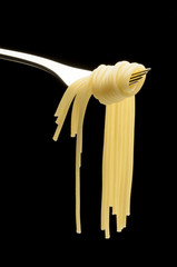 fork with illuminated spaghetti in studio
