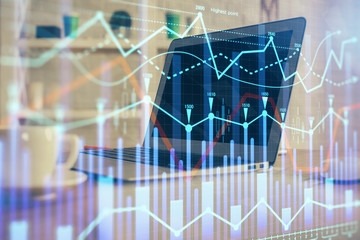 Forex market chart hologram and personal computer background. Multi exposure. Concept of investment.