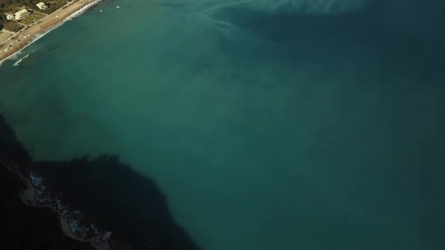 Aerial view from the popular beach at Corfu Island in Greece. A double-mirrored-gulf beach surrounded by vivid water in an unrealistic way