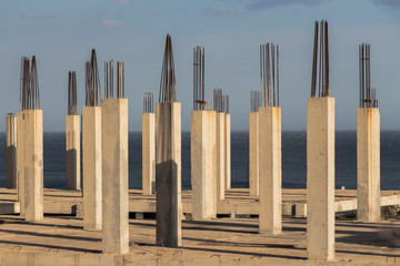 concrete pillars with sea in the background, concrete formwork
