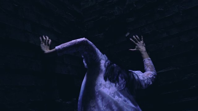 Possessed woman convulsing in darkness, evil spirit transmission, witchcraft