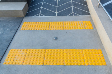 Concert ramp way with stainless steel handrail with disabled sign for support wheelchair disabled...