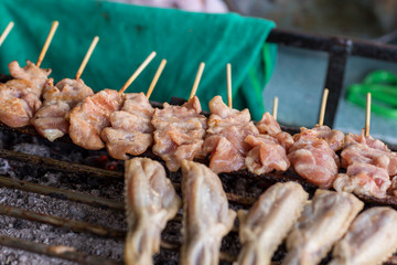Barbecue pork Toast grill or Toast pork with Thai garnish nutrition preparation for cooking. Thai food, Street food. Pork satay grilling on stove or Thai style roasted pork at the market.