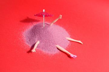 doll and pink sand