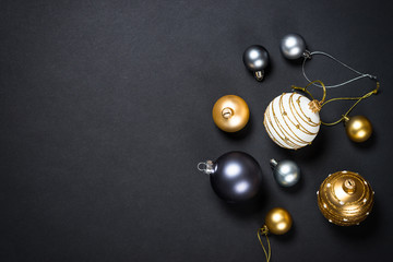 Christmas background with decorations on black.