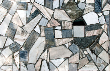 Pieces of marble. A wall consisting of a piece of marble.