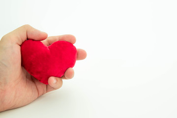red heart in hand in isolated white background, love symbol concept