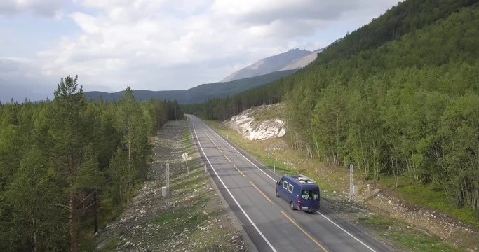 Sprinter Van driving through norwegian forest