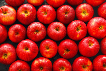 Many ripe apples as background