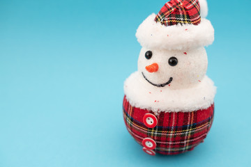 Christmas-tree decorations on blue background. Snowman toy