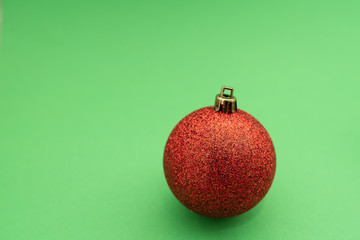 Christmas-tree decorations on green background. Christmas toy