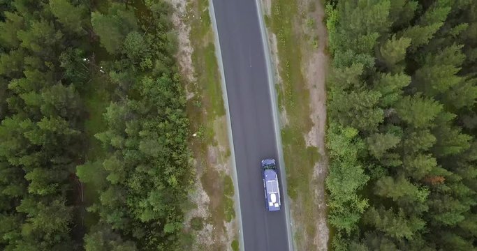 Sprinter Van driving through norwegian forest from above