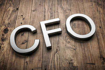 Diagonal white 3d letters CFO on wooden planks. 3d render.