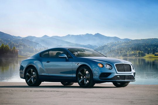 Bentley Continental GT near lake and mountain