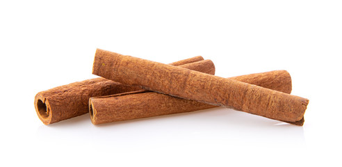  cinnamon sticks stacked on white background